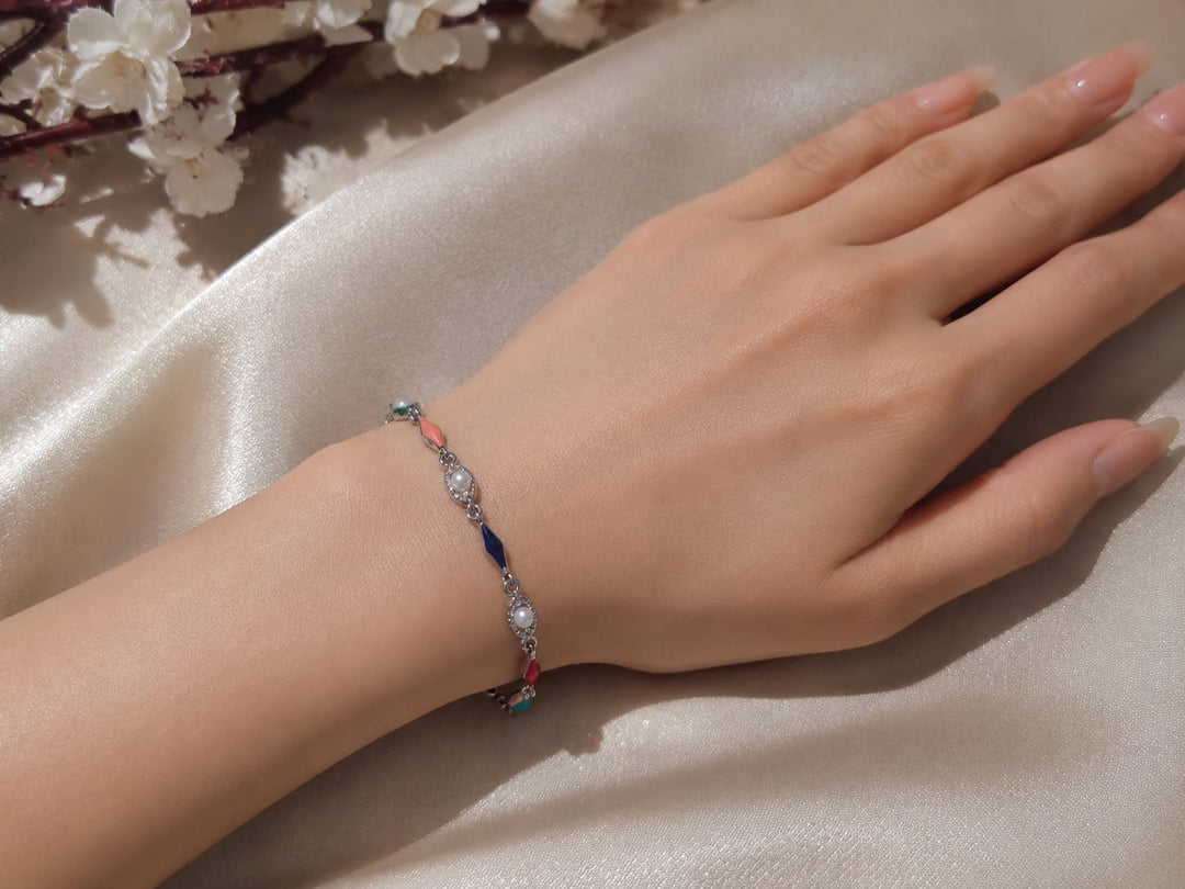 Anti tarnished silver-tone bracelet featuring colorful enamel accents and delicate pearl detailing ✨