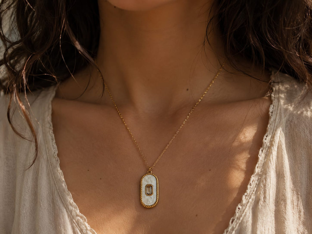 Oval-shaped stone pendant.