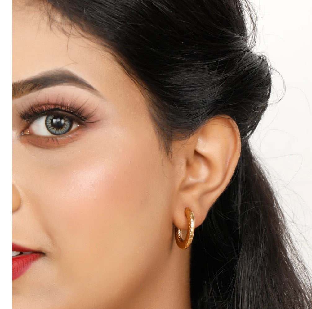 Gold-plated textured half hoop earrings with a post and back closure.