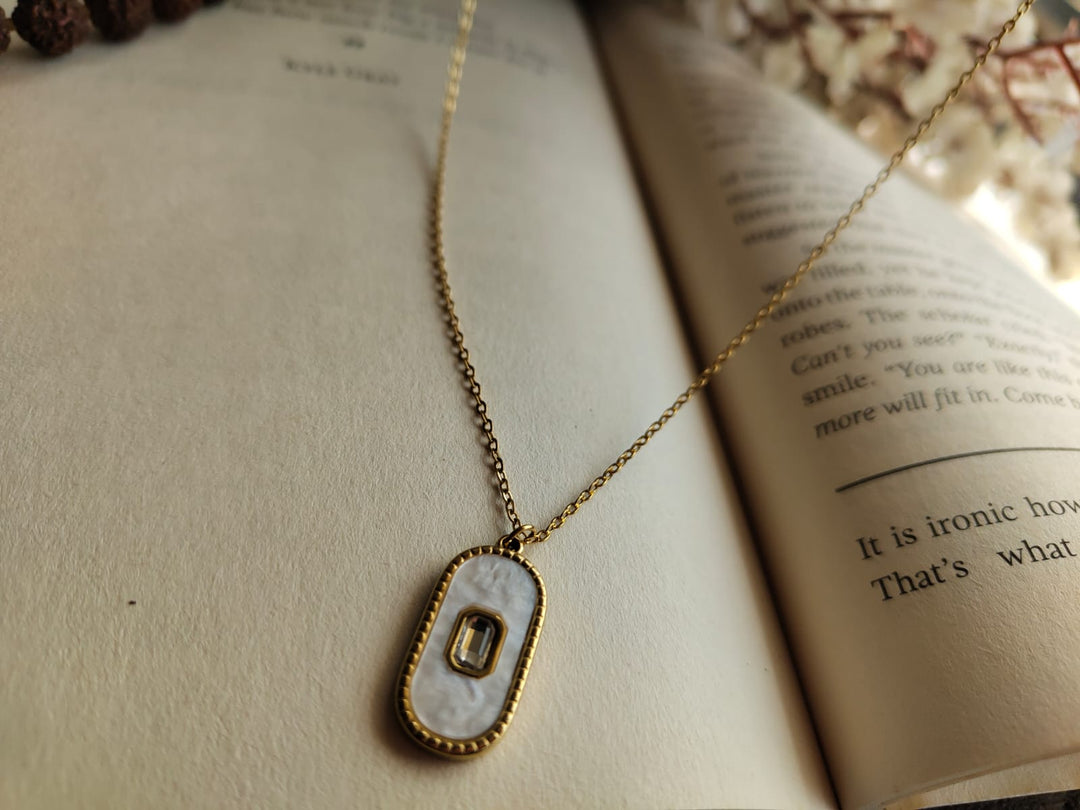 Oval-shaped stone pendant.