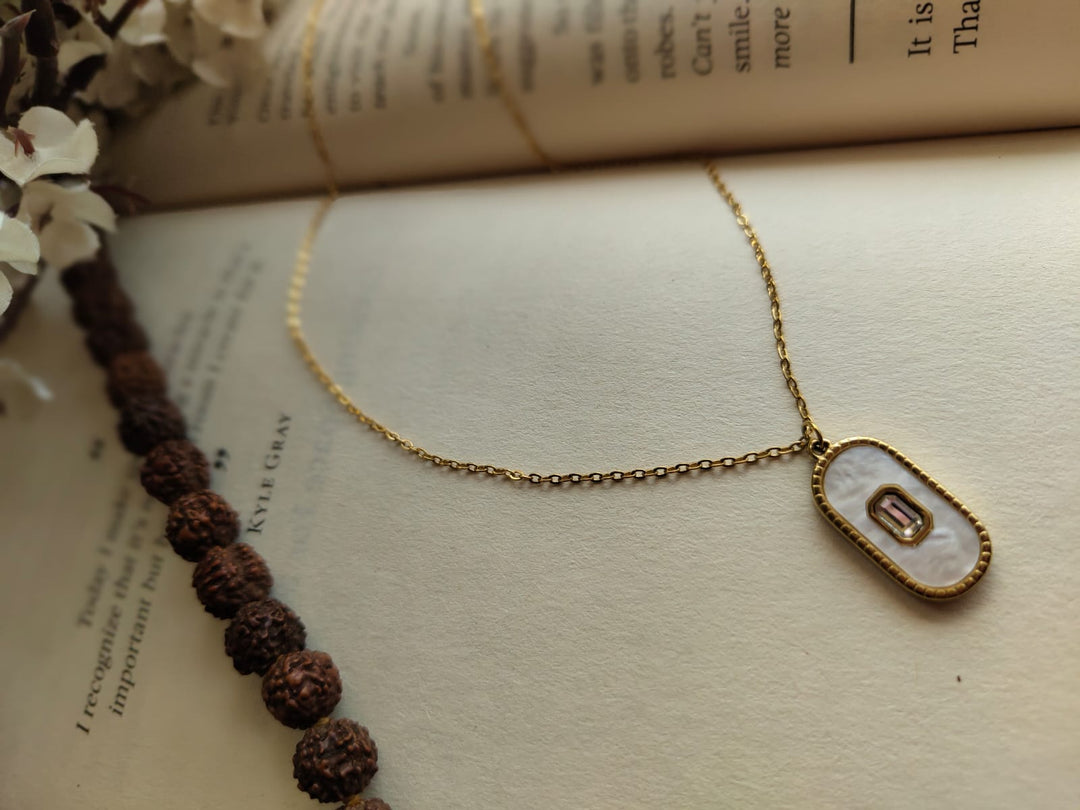 Oval-shaped stone pendant.