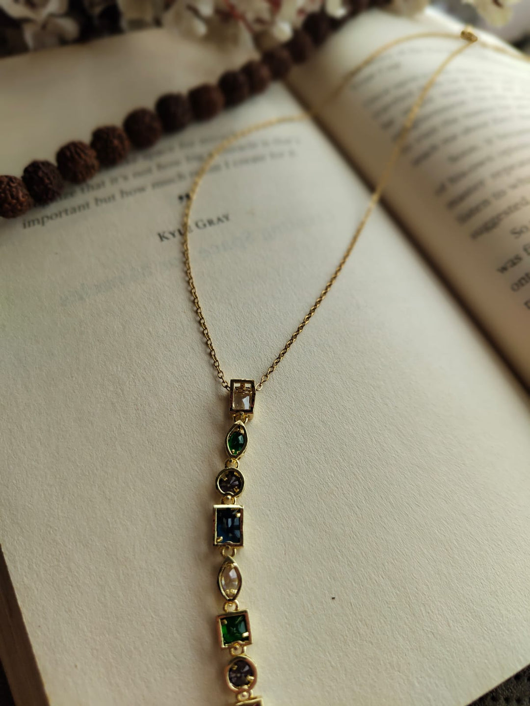 Multicolored stone pendant necklace.